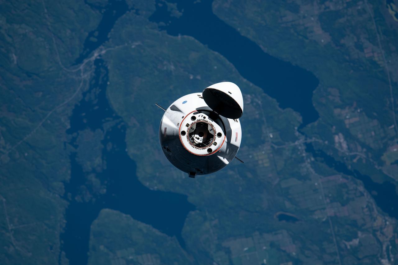 iss065e327741 (Aug. 30, 2021) --- The SpaceX Cargo Dragon vehicle approaches the International Space Station for an autonomous docking to the Harmony module's forward international docking adapter.