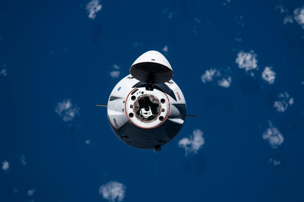 iss065e327840 (Aug. 30, 2021) --- The SpaceX Cargo Dragon vehicle approaches the International Space Station for an autonomous docking to the Harmony module's forward international docking adapter.