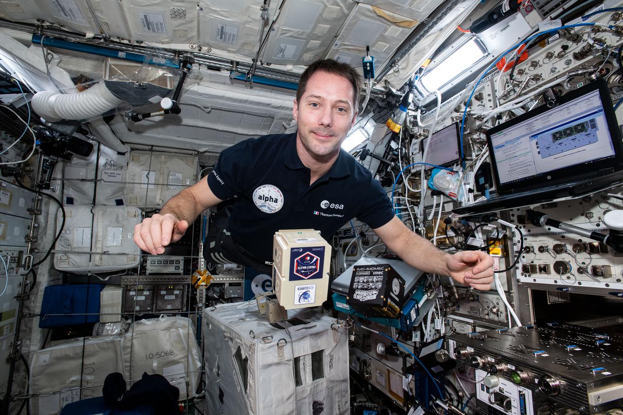 iss065e343728 (9/2/2021) --- European Space Agency (ESA) astronaut Thomas Pesquet is pictured aboard the International Space Station Columbus module with the Ice Cube #8 and #9 BioCubes. The Ice Cube #8 investigation uses quantum technology to produce high-resolution, high-precision measurements of the local magnetic field to create a high-resolution map of the Earth’s magnetic field. Ice Cube #9 seeks to analize the Skin Microbiome of Diabetic Foot Ulcers