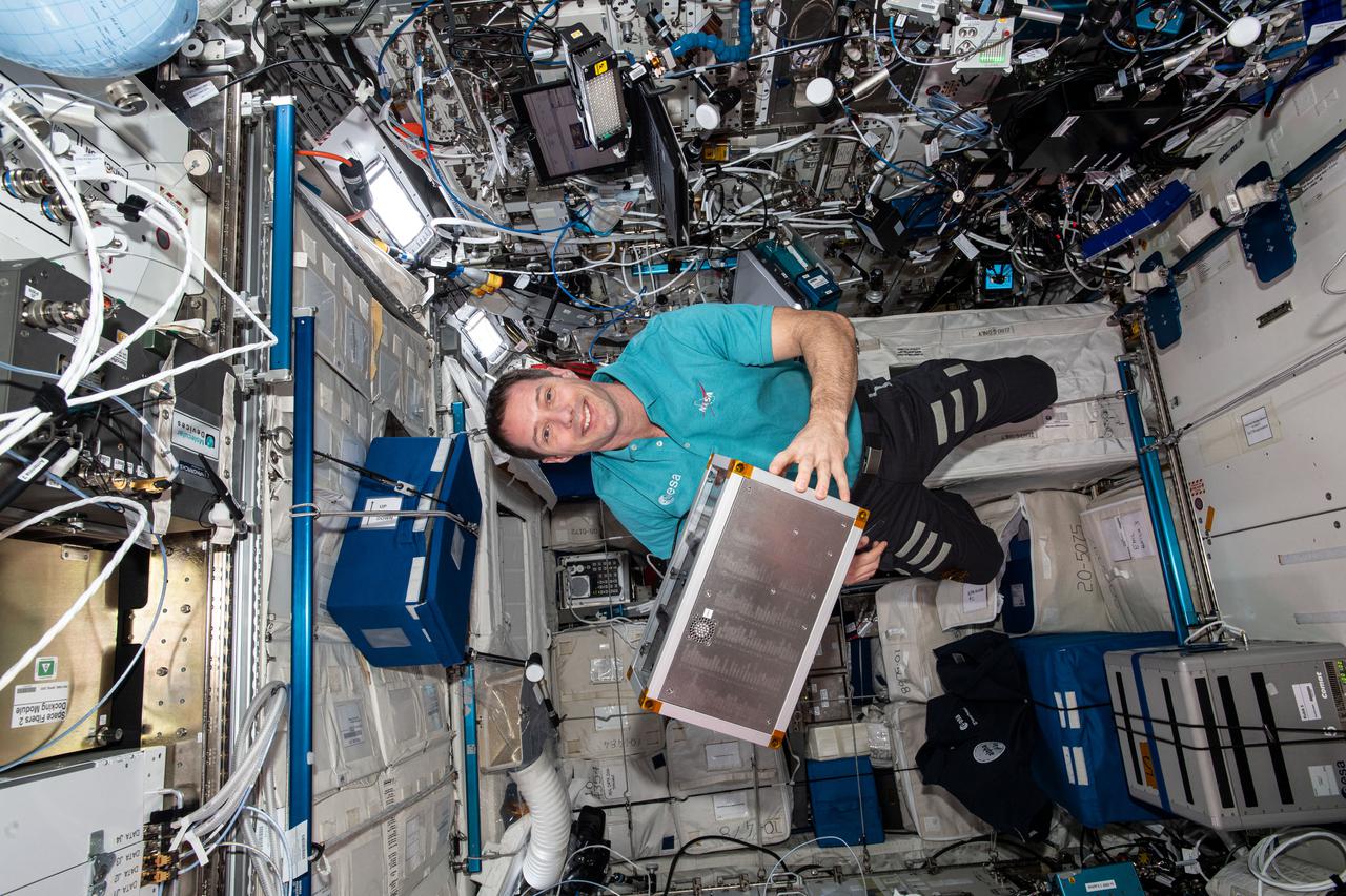iss065e347821 (9/3/20210 --- European Space Agency (ESA) astronaut Thomas Pesquet is seen with the technology Box investigation in the columbus module aboard the International Space Station (ISS). The main objective of Technology Box (Tetr’ISS) is to conduct experiments gathered in support equipment called ‘Platform’, to illustrate science principles based on physics and chemistry. For this mission Tetr’ISS contains the Chladni’s Figures experiment: a physical science experiment to observe the sound waves in 3D thanks to fine particles organized according to nodes and antinodes.