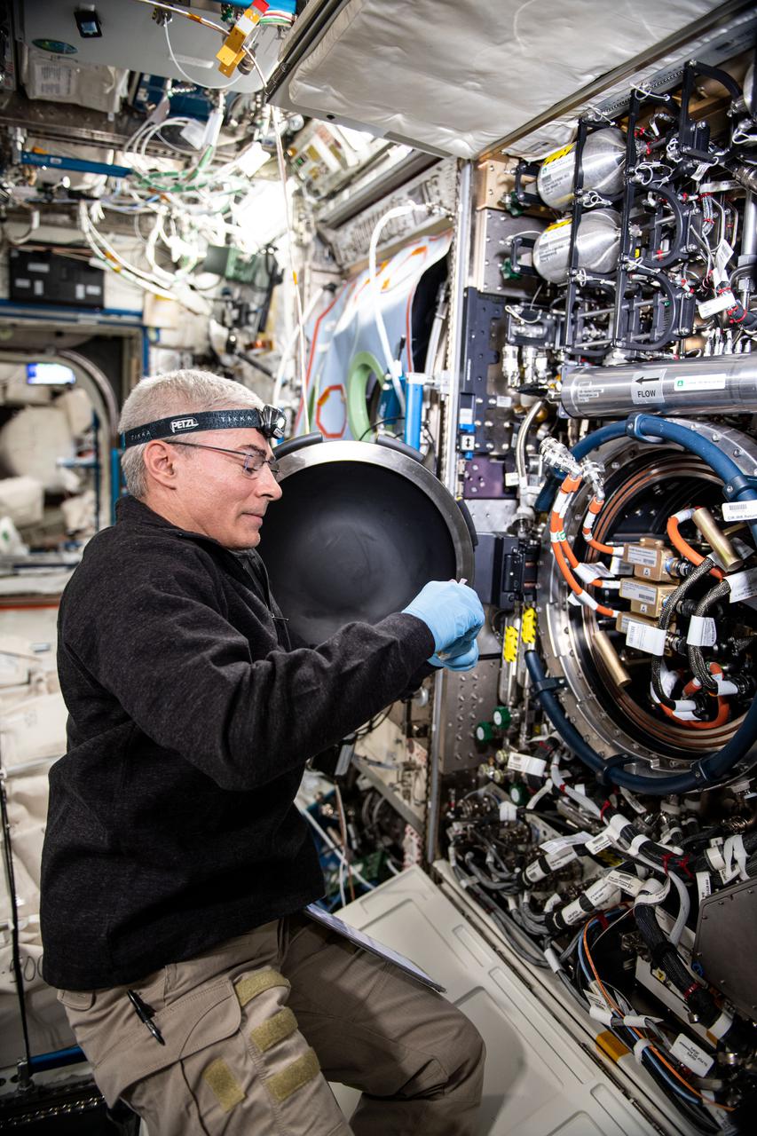 iss065e369687 (Sept. 8, 2021) ----NASA astronaut and Expedition 65 Flight Engineer Mark Vande Hei replaces an igniter inside the U.S. Destiny laboratory module's Combustion Integrated Rack for the ACME series of space combustion studies. ACME, or the Advanced Combustion via Microgravity Experiments, is a set of six independent studies of gaseous flames that seeks to improve fuel efficiency and reduce pollutants on Earth, and improve spacecraft fire prevention by focusing on decreasing the flammability of materials.