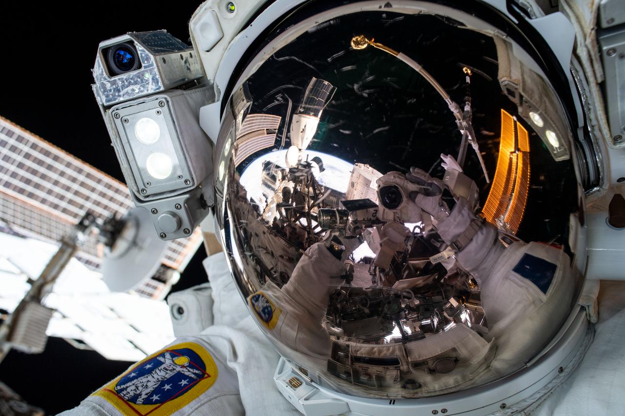 iss065e376212 (Sept. 12, 2021) --- ESA (European Space Agency) astronaut Thomas Pesquet is pictured with his helmet visor down in this "space-selfie" taken during a spacewalk.