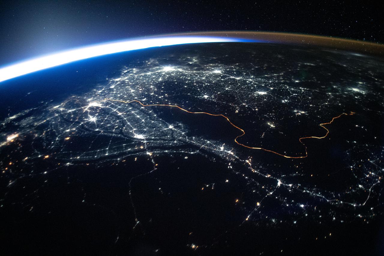 iss065e385549 (Sept. 15, 2021) --- The International Space Station was orbiting 263 miles above Afghanistan when this photograph was taken of the city lights of Pakistan and India and the well-lit border separating both countries.