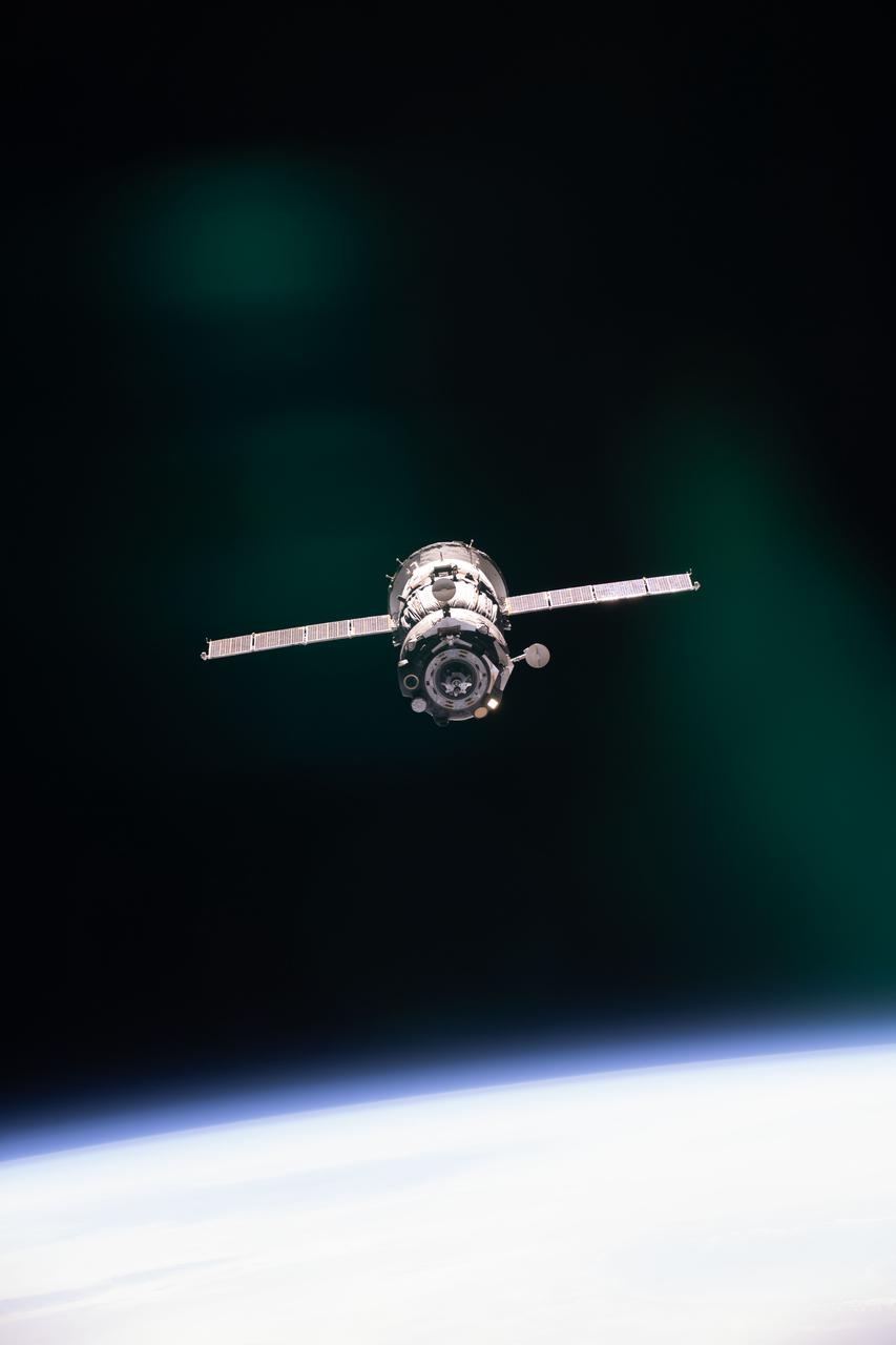 iss065e430927 (Sept. 28, 2021) --- The Soyuz MS-18 spacecraft carrying three Expedition 65 crewmates is pictured during its relocation maneuver from the Rassvet module to the Nauka multipurpose laboratory module.
