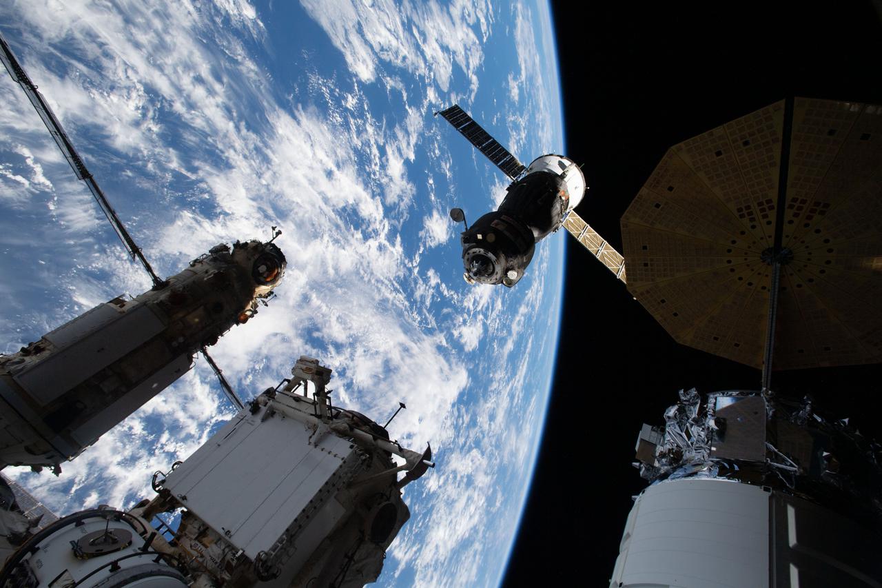iss065e431430 (Sept. 28, 2021) --- The Soyuz MS-18 spacecraft carrying three Expedition 65 crewmates is pictured during its relocation maneuver from the Rassvet module to the Nauka multipurpose laboratory module.