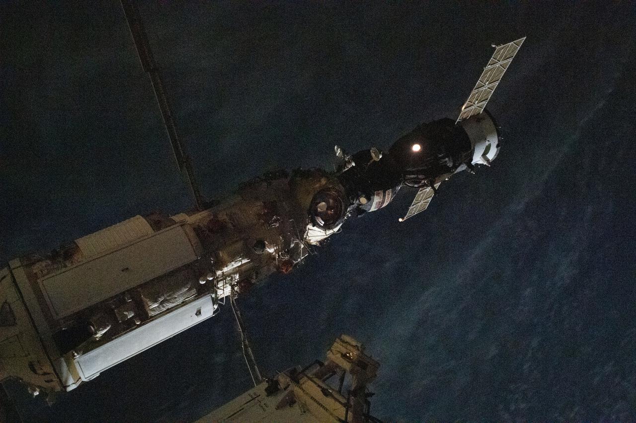 iss065e431591 (Sept. 28, 2021) --- The Soyuz MS-18 spacecraft carrying three Expedition 65 crewmates is pictured docked to the Nauka multipurpose laboratory module moments after completing its relocation maneuver from the Rassvet module.