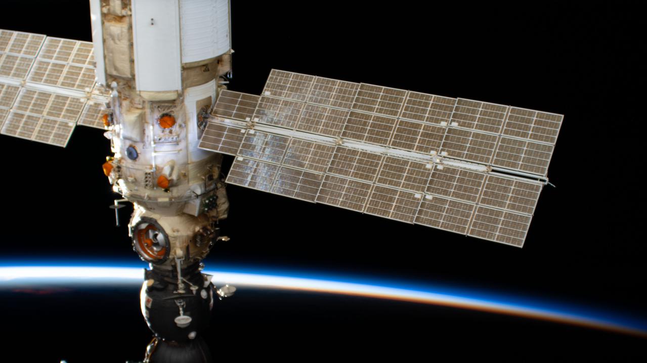 iss065e469179 (Oct. 14, 2021) --- The Nauka multipurpose laboratory module with the docked Soyuz MS-18 crew ship is pictured as the International Space Station orbited 265 miles above the Pacific Ocean into an orbital sunset.