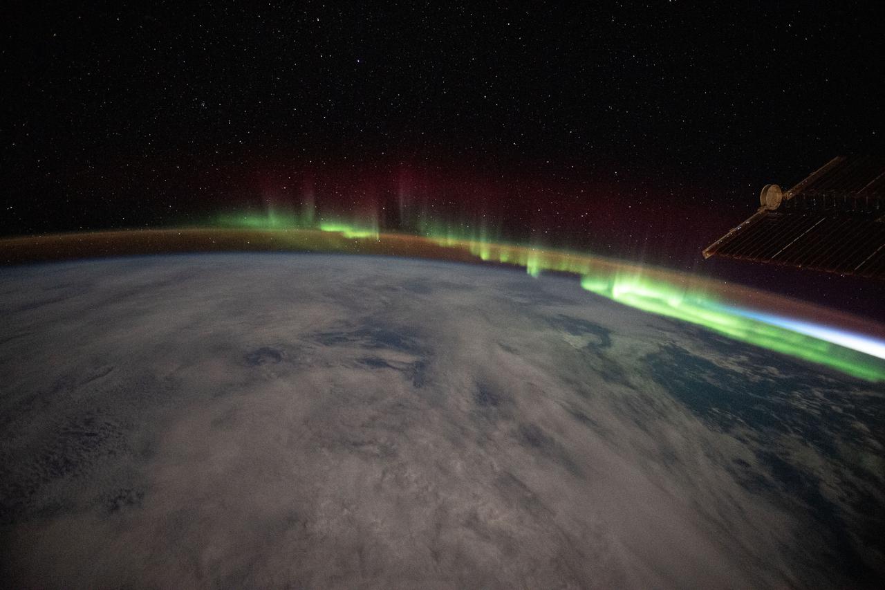 iss065e473649 (Oct. 13, 2021) --- An aurora streams over the Earth as the International Space Station orbited 273 miles above the southern Indian Ocean in between Australia and Antarctica.