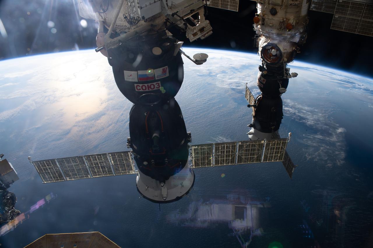 iss065e483092 (Oct. 16. 2021) --- Two Soyuz crew ships are pictured docked at the International Space Station as it orbited 264 miles above the Indian Ocean in between Australia and Indonesia. From front to back, the Soyuz MS-19 is docked to the Rassvet module and the Soyuz MS-18 is docked to the Nauka multipurpose laboratory module.