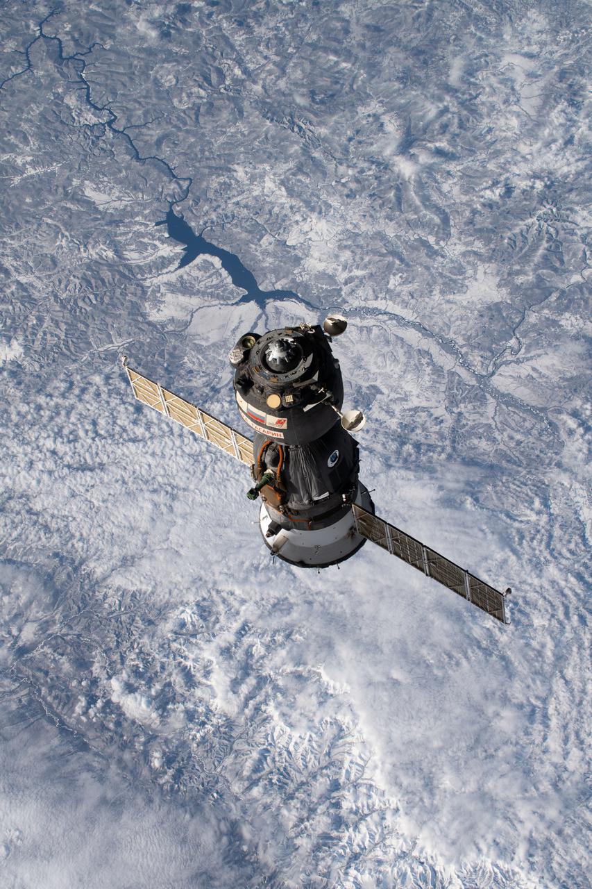 iss066e001106 (Oct. 17, 2021) --- The Soyuz MS-18 crew ship, carrying Soyuz Commander Oleg Novitskiy and spaceflight participants Yulia Peresild and Klim Shipenko, is pictured moments after undocking from the International Space Station's Nauka multipurpose laboratory module as both spacecraft were orbiting 263 miles above far eastern Russia.