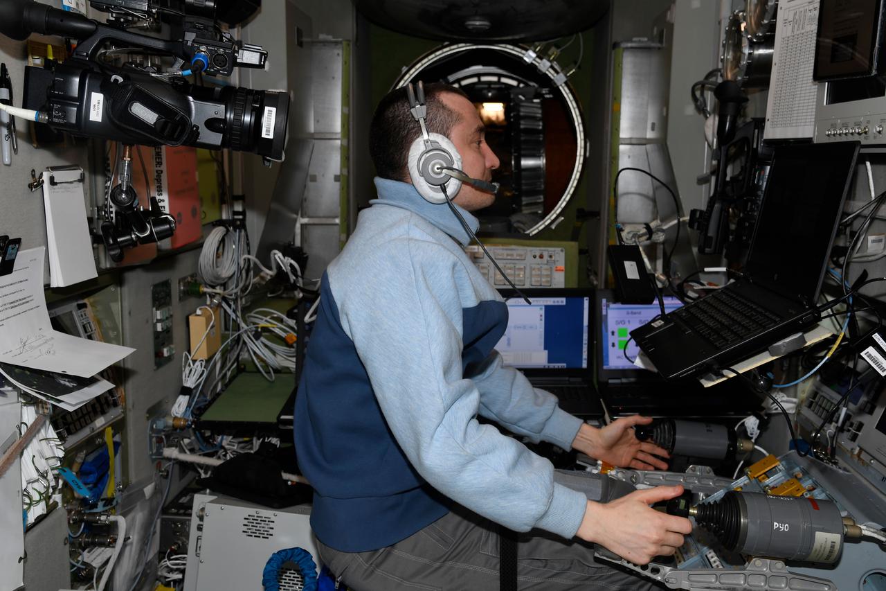 iss066e001368 (Oct. 19, 2021) --- Roscosmos cosmonaut and Expedition 65 Flight Engineer Pyotr Dubrov trains on a computer in the Zvezda service module for the undocking of the ISS Progress 78 resupply ship from the Rassvet module and its relocation to the Nauka multipurpose laboratory module. Dubrov practiced on Zvezda’s tele-robotically operated rendezvous unit (TORU) for the unlikely event he would have to manually redock the 78P.