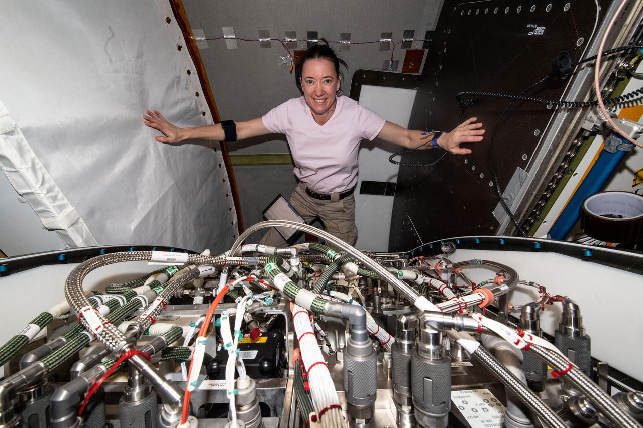 iss066e003338 (Oct. 20, 2021) --- NASA astronaut and Expedition 66 Flight Engineer Megan McArthur replaces components and flushes contaminants inside the Tranquility module's U.S. oxygen generation system.
