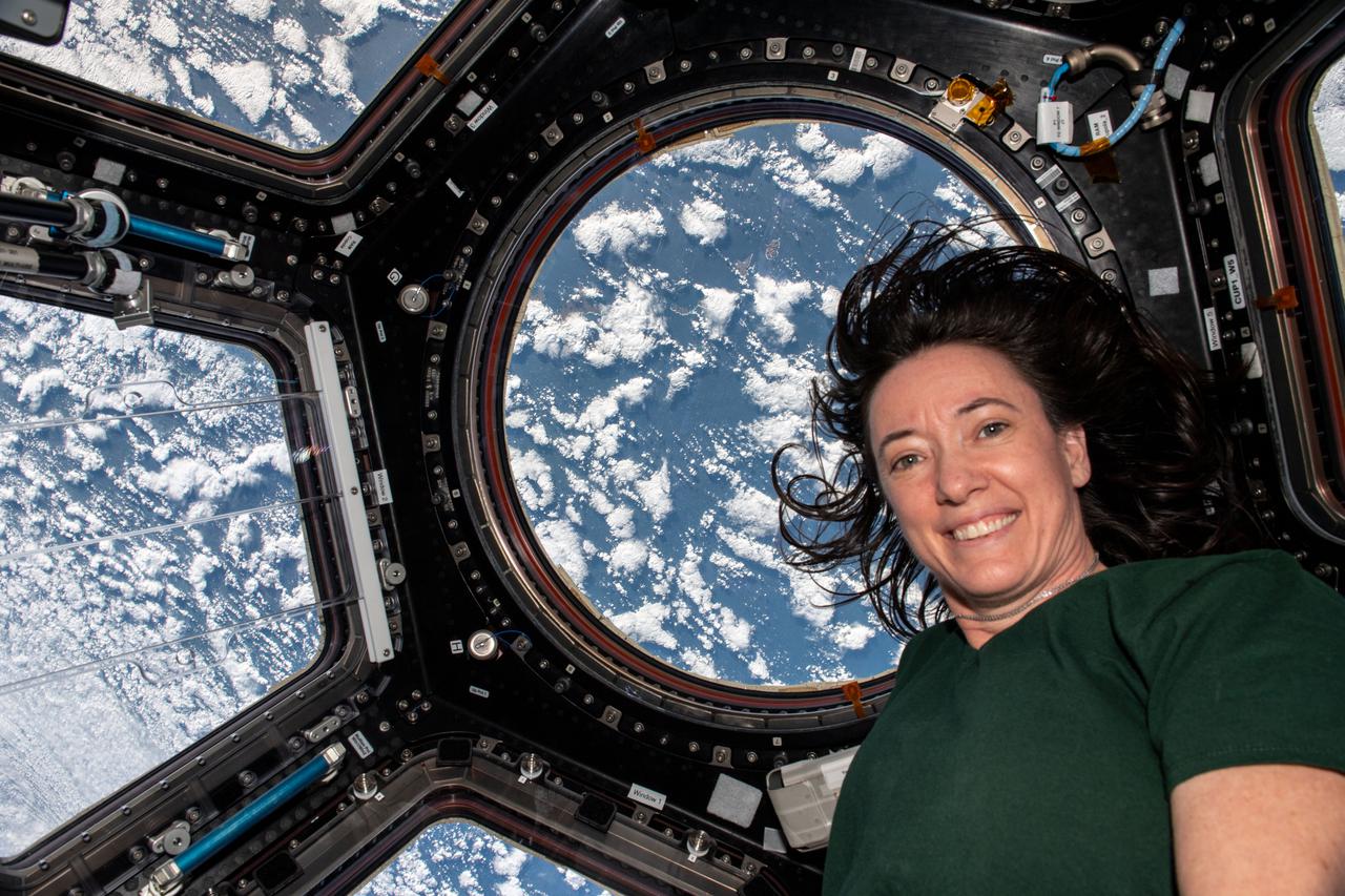 iss066e008177 (Oct. 21, 2021) --- NASA astronaut and Expedition 66 Flight Engineer Megan McArthur is pictured inside the cupola as the International Space Station orbited 263 miles above Alaska's Aleutian Islands in between the Bering Sea and the Pacific Ocean.