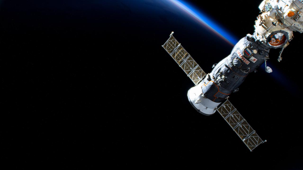 iss066e008343 (Oct. 22, 2021) --- Russia's ISS Progress 78 cargo craft is pictured docked to the Nauka multipurpose laboratory module as the International Space Station orbited 273 miles above the south Pacific Ocean into an orbital sunset.