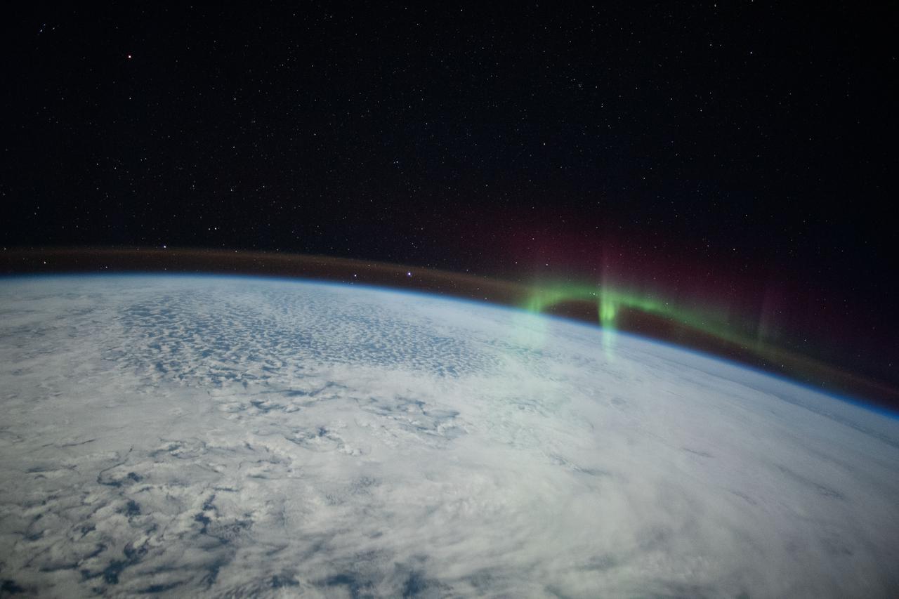 iss066e008713 (Oct. 19, 2021) --- A wispy aurora, intersecting with Earth's airglow, is pictured from the International Space Station as it orbited 274 miles above the Indian Ocean in between Australia and Antarctica.