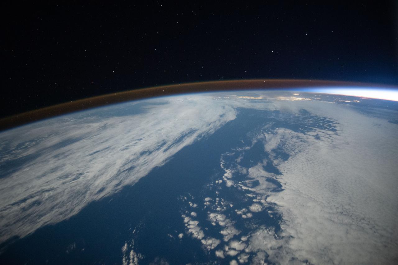 iss066e008725 (Oct. 22, 2021) --- The airglow blankets the Earth's horizon during an orbital sunset in this photograph from the International Space Station as it orbited 262 miles above the Pacific Ocean southwest of California.