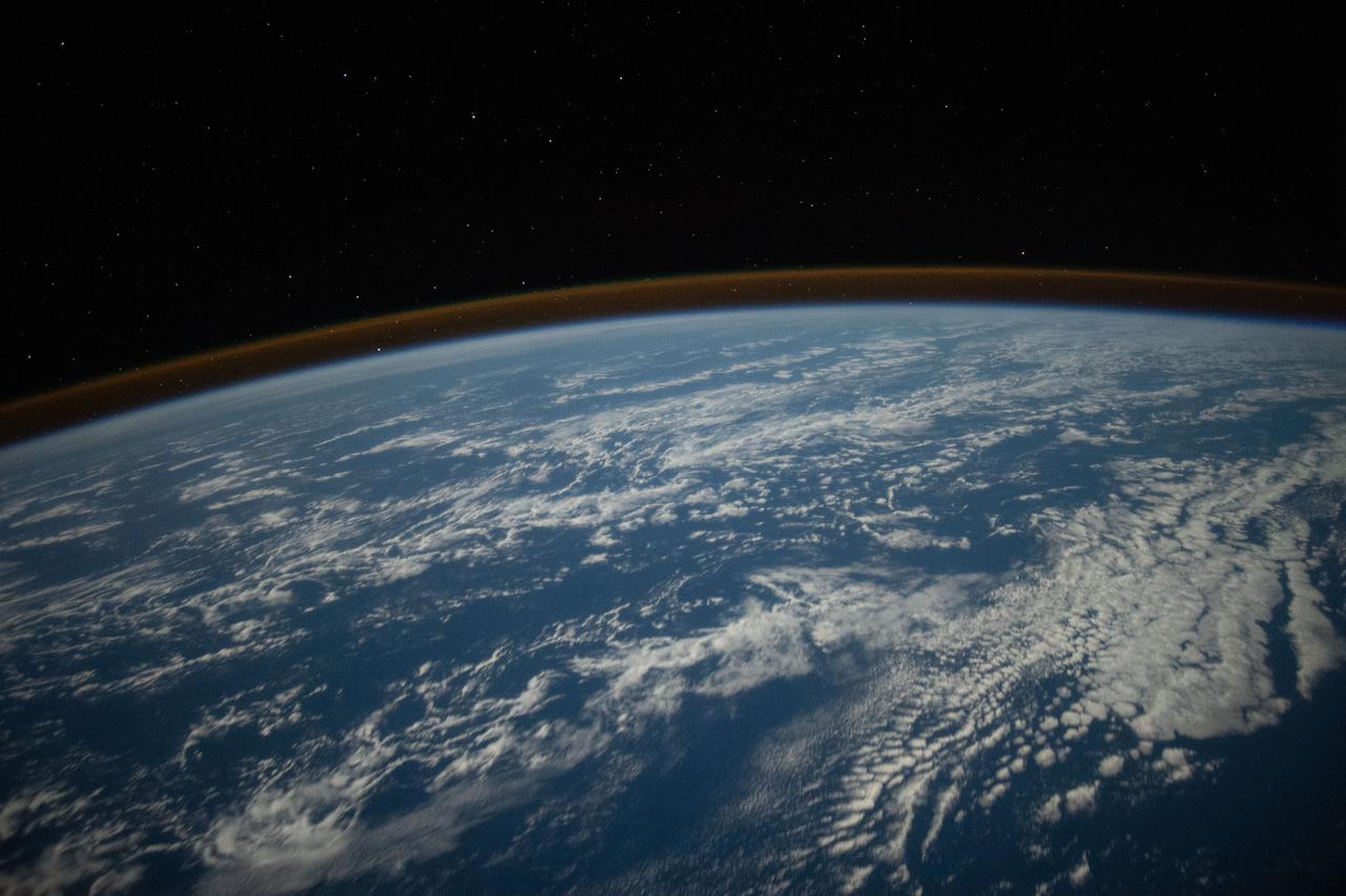 iss066e008725 (Oct. 22, 2021) --- The airglow blankets the Earth's horizon in this photograph from the International Space Station as it orbited 262 miles above the Pacific Ocean just south of the Hawaiian island chain.