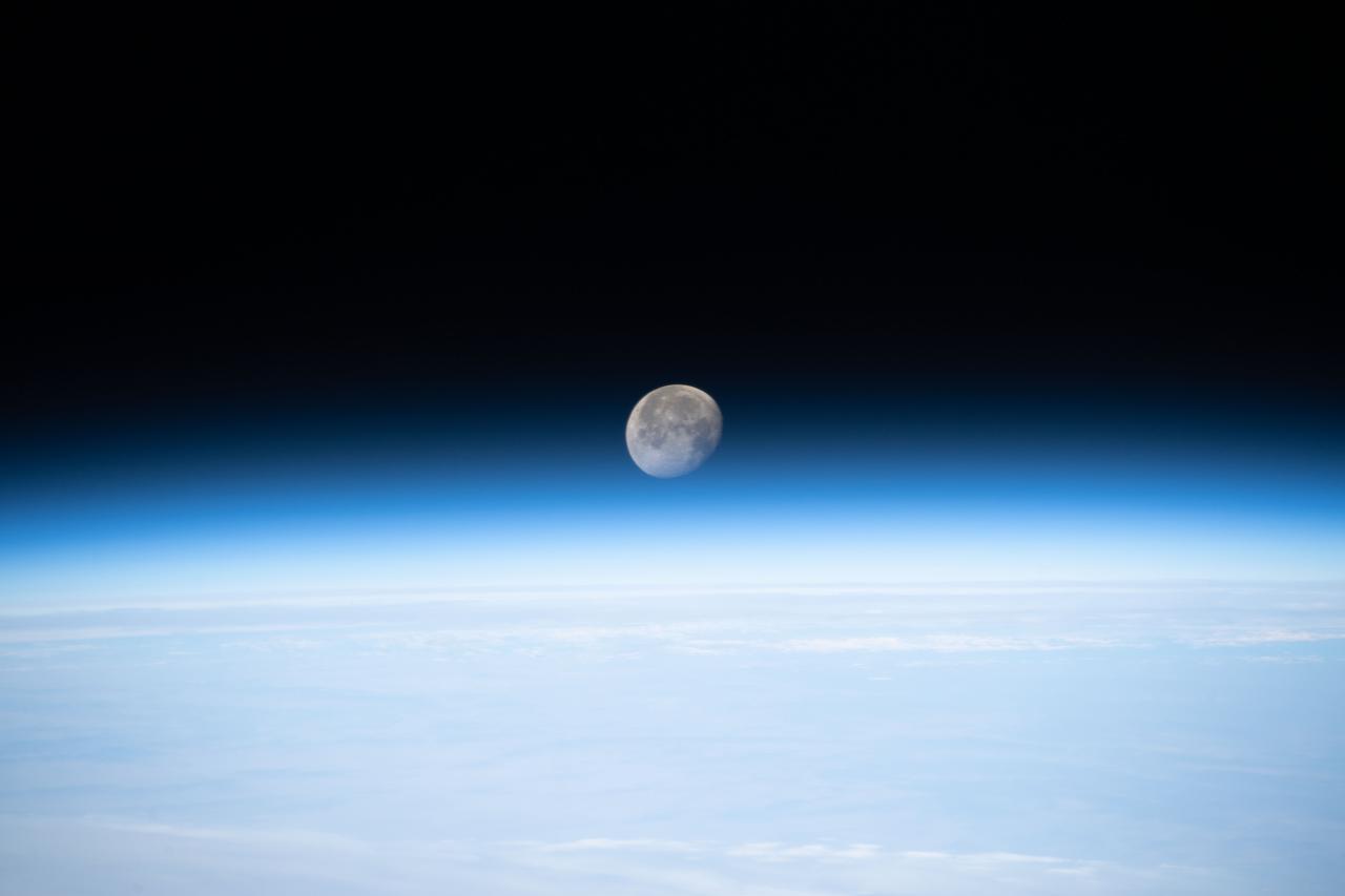 iss066e010463 (Oct. 24, 2021) --- The waning gibbous Moon is pictured just above Earth's horizon as the International Space Station orbited 261 miles above eastern China.