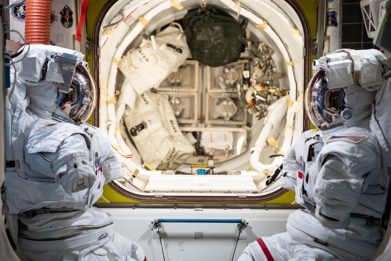 iss066e019166 (Oct. 28, 2021) --- A pair of U.S. spacesuits are pictured inside the International Space Station's U.S. Quest airlock ready for an upcoming spacewalk to be conducted by NASA astronauts Thomas Marshburn and Kayla Barron.