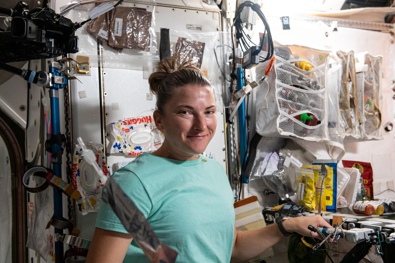 iss066e078575 (Nov. 18, 2021) --- NASA astronaut and Expedition 66 Flight Engineer Kayla Barron is pictured during the breakfast period aboard the International Space Station.