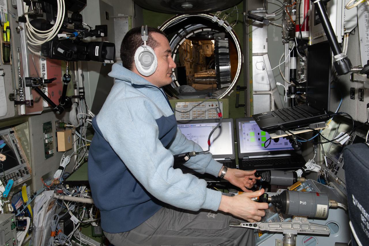 iss066e078866 (Nov. 22, 2021) --- Roscosmos cosmonaut and Expedition 66 Flight Engineer Pyotr Dubrov trains on a computer in the Zvezda service module for the approach and docking of the Prichal docking module to the Nauka multipurpose laboratory module. Dubrov practiced on Zvezda’s tele-robotically operated rendezvous unit (TORU) for the unlikely event he would have to manually dock Prichal attached to the Progress delivery craft.