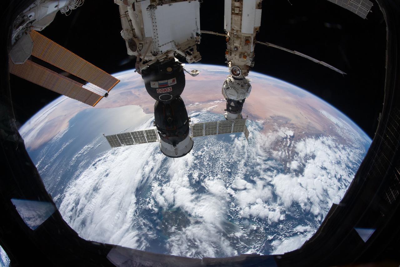 iss066e086732 (Dec. 6, 2021) --- Pictured as the International Space Station orbited 264 miles above the Mediterranean Sea are the Soyuz MS-19 crew ship docked to the Rassvet module and the Prichal module, still attached to the Progress delivery craft, docked to the Nauka multipurpose module.