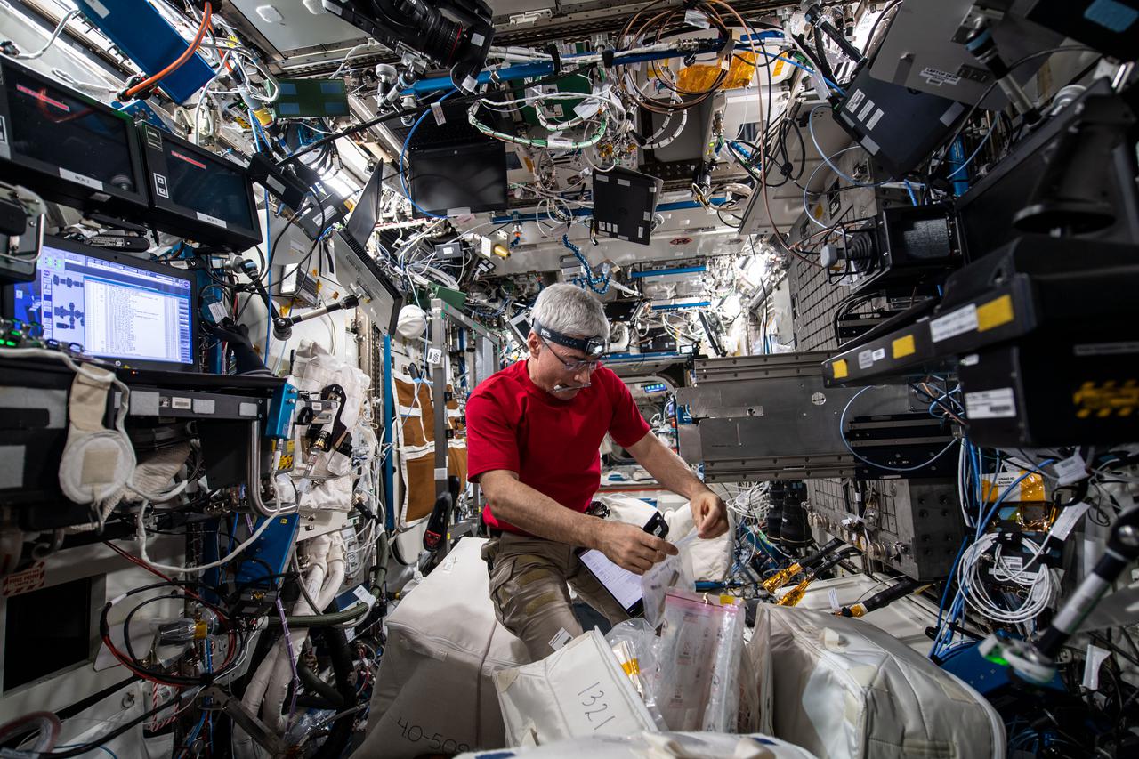 View of Mark Vande Hei setting up Mark Flow Boiling and Condition Experiment during Expedition 66.