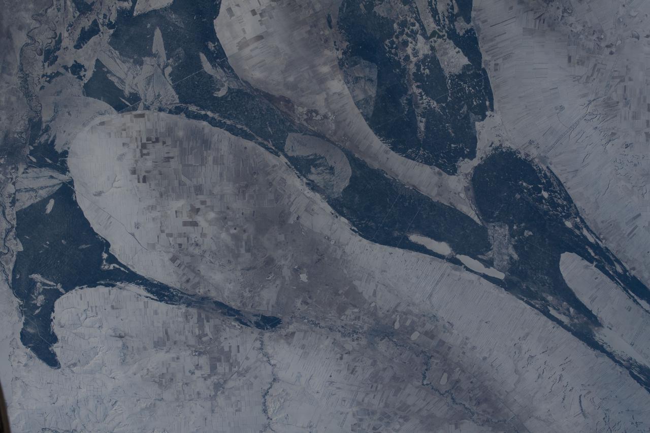 iss066e089960 (Dec. 11, 2021) --- Kazakhstan's snowy, northeast border with Russia is pictured from the International Space Station as it orbited 266 miles above central Asia.