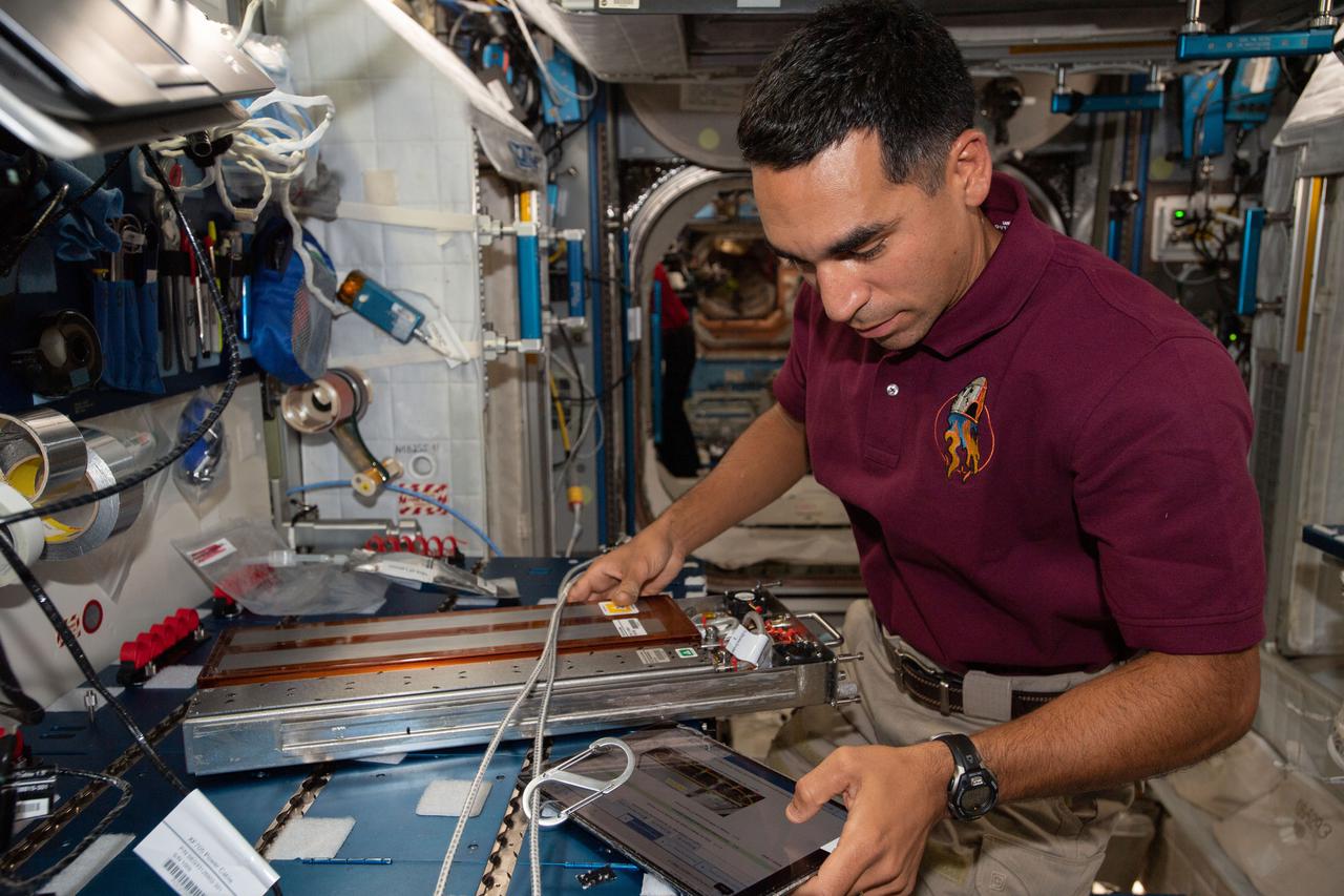 iss066e091053 (Dec. 15, 2021) --- NASA astronaut and Expedition 66 Flight Engineer Raja Chari works inside the Harmony module setting up the Advanced Plant Habitat before the arrival of new space botany experiments inside the SpaceX Cargo Dragon resupply ship.