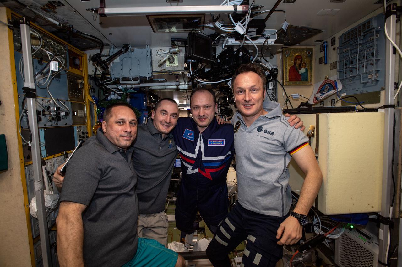iss066e093675 (Dec. 19, 2021) --- From left are, Roscosmos cosmonauts Anton Shkaplerov, Pyotr Dubrov and Alexander Misurkin with ESA (European Space Agency) astronaut Matthias Maurer aboard the International Space Station's Russian segment.