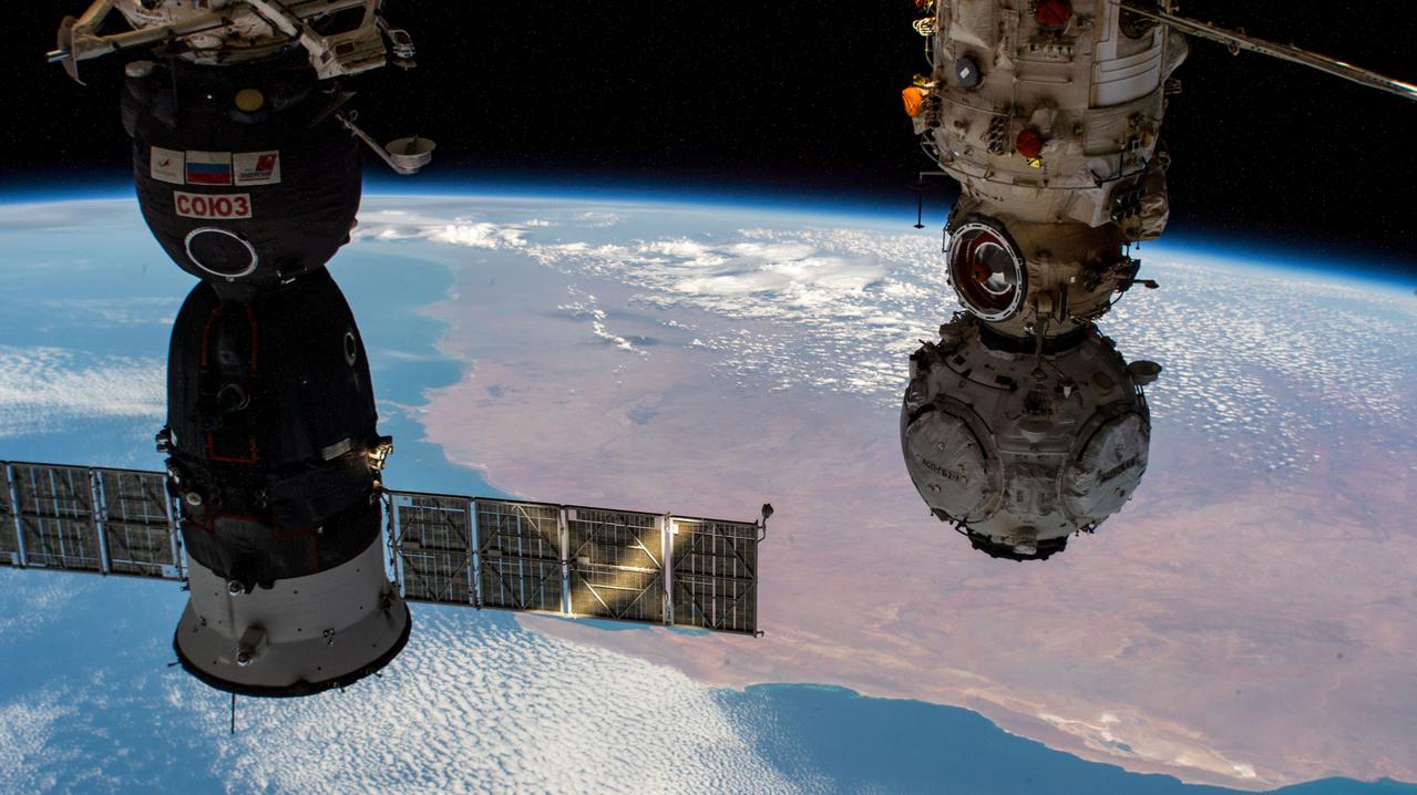 iss066e096810 (Dec. 24, 2021) --- Pictured from left, are the Soyuz MS-19 crew ship and the Nauka multipurpose laboratory module with the Prichal docking module attached as the International Space Station orbited 266 miles above the Indian Ocean off the western coast of Australia.