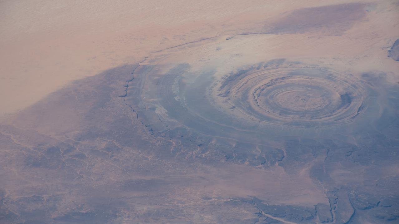 iss066e102086 (Dec. 31, 2021) --- The Richat structure, an eroded geological dome, located in the African nation of Mauritania, is pictured from the International Space Station as it orbited 262 miles above Earth.