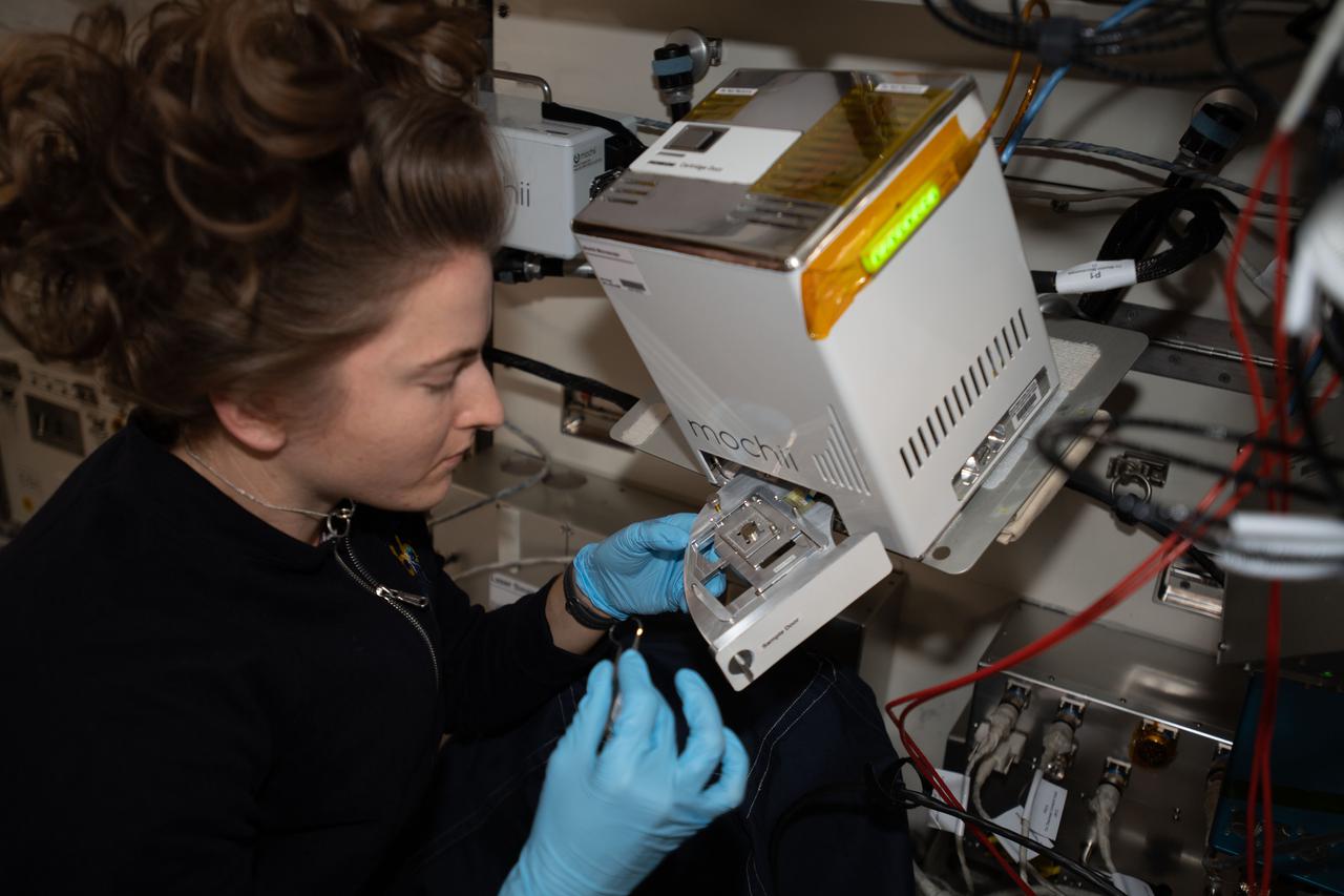iss066e110566 (1/10/2022) --- NASA astronaut Kayla Barron sets up the Mochii microscope. Mochii is a miniature scanning electron microscope (SEM) with spectroscopy to conduct real-time, on-site imaging and compositional measurements of particles on the International Space Station (ISS).