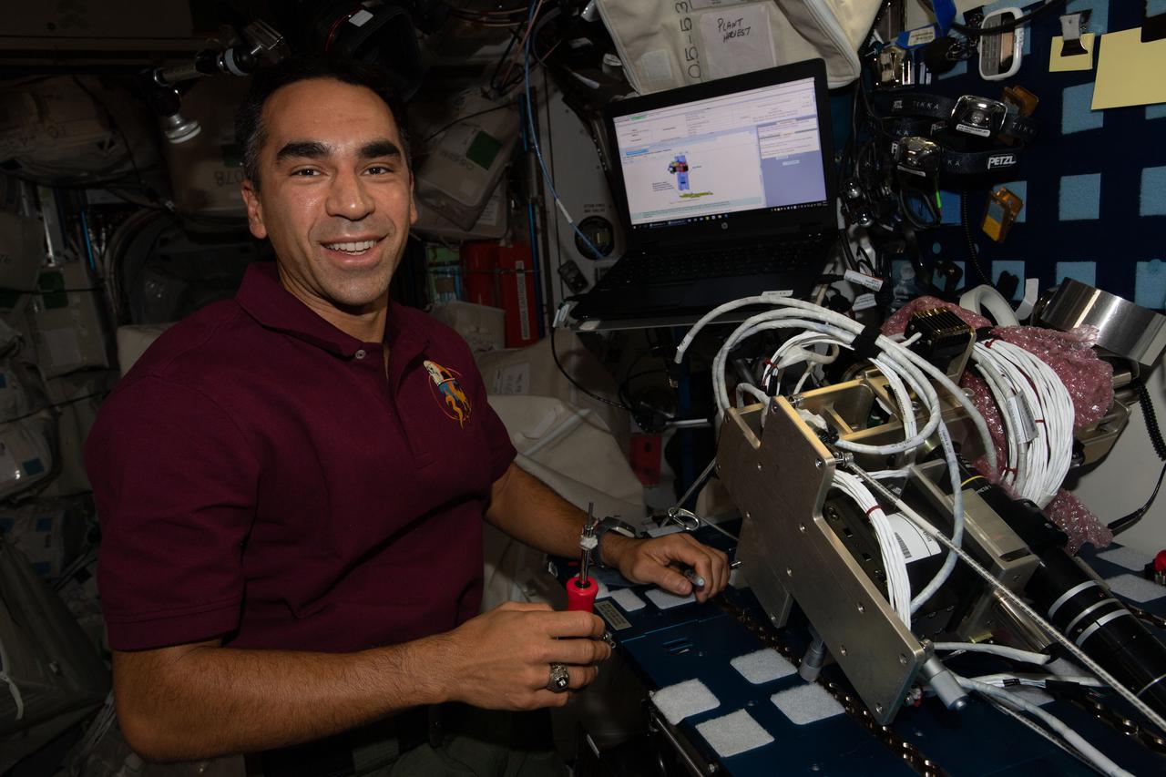 iss066e111006 (Jan. 12, 2022) --- NASA astronaut and Expedition 66 Flight Engineer Raja Chari removes components from the Ring Sheared Drop experiment that could lead to a better understanding of neurodegenerative diseases such as Alzheimer’s.