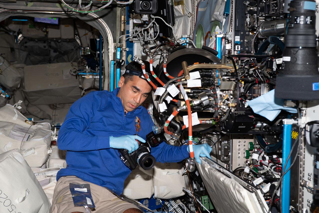 iss066e114301 (Jan. 17, 2022) --- NASA astronaut and Expedition 66 Flight Engineer Raja Chari replaces hardware inside the Combustion Integrated Rack that supports the ACME (Advanced Combustion via Microgravity Experiments) study. ACME is a series of six independent studies of gaseous flames seeking to improve fuel efficiency, reduce pollution, and promote spacecraft fire prevention.