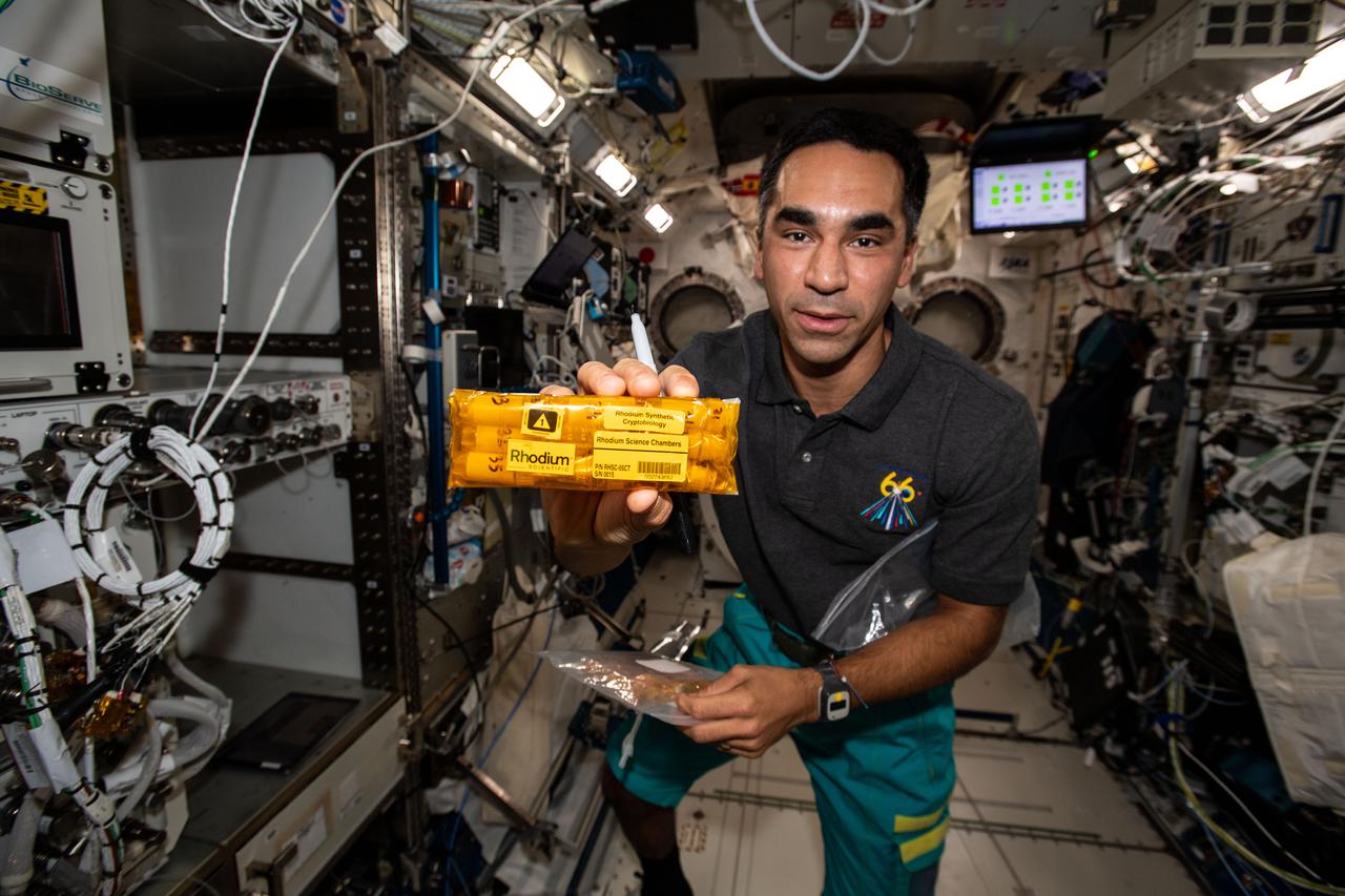 iss066e123191 (Jan. 20, 2022) --- NASA astronaut Engineer Raja Chari gathers items for the Rhodium Synthetic Cryptobiology experiment for packing inside the SpaceX Cargo Dragon resupply ship. Results from the biotechnology study could help create more rugged biological components and advance these technologies for use in space and in extreme environments on Earth.