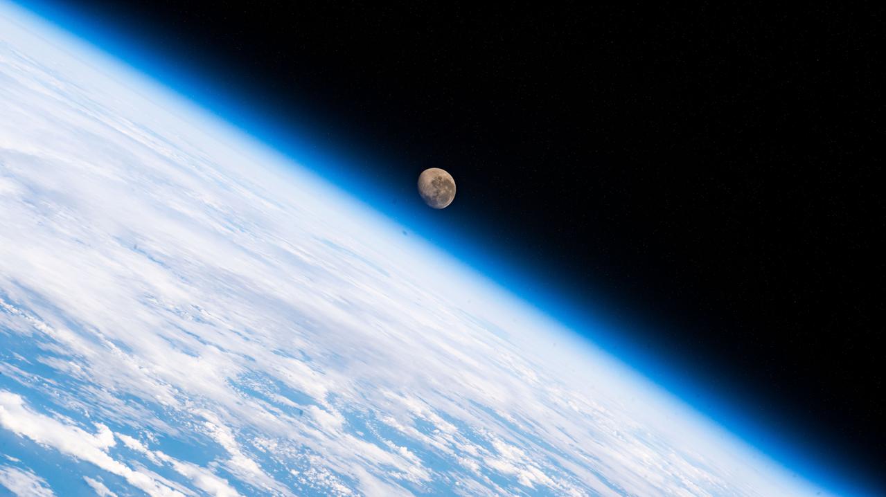 iss066e123388 ​(Jan. 21, 2022) --- The waning gibbous Moon is pictured above the Earth's horizon as the International Space Station orbited 272 miles above the Atlantic Ocean in betweenthe tips of South America and South Africa.