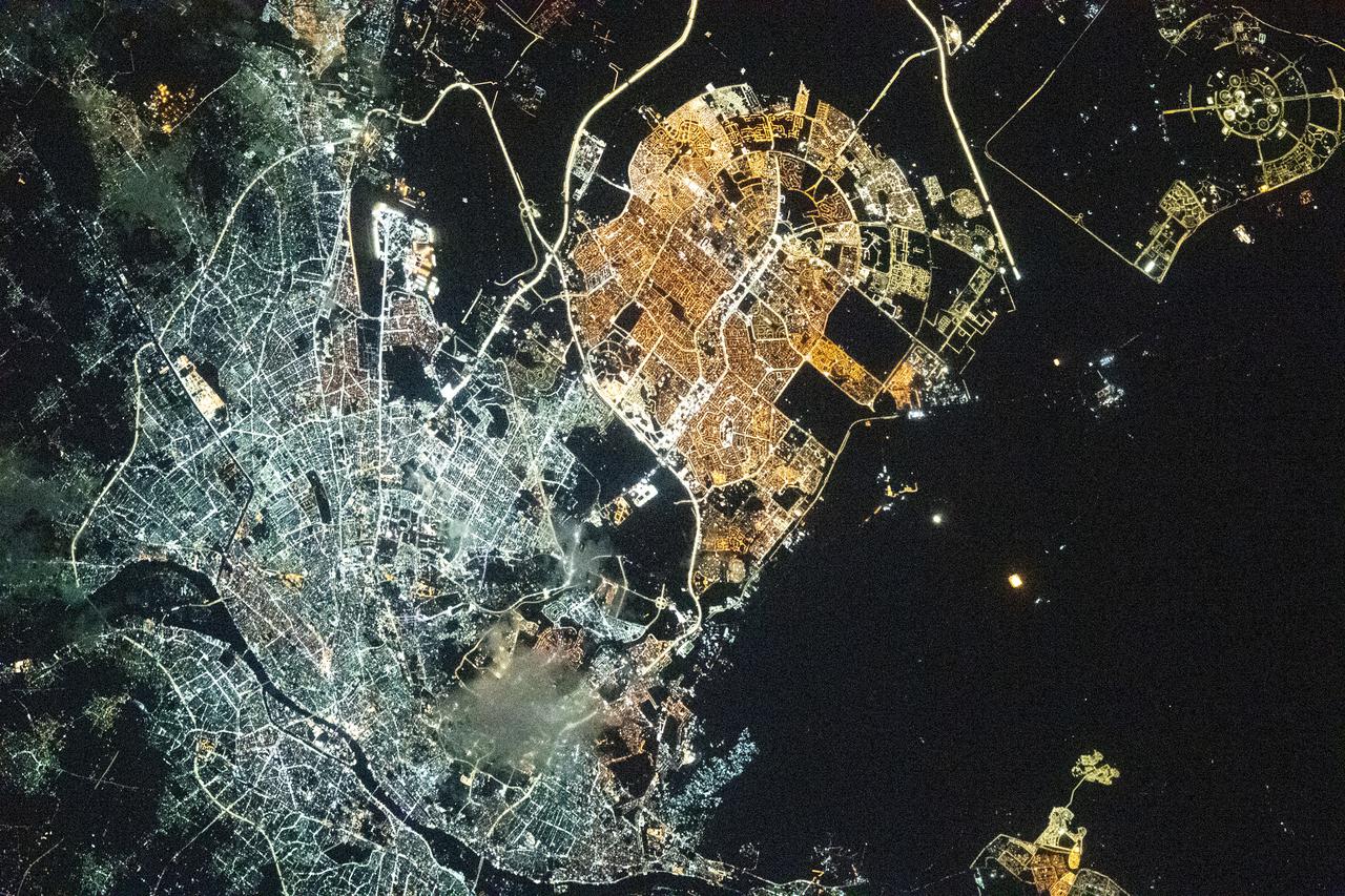 iss066e128266 (Jan. 26, 2022) --- The city lights of Cairo and New Cairo City in Egypt are pictured during an orbital nightime pass from the International Space Station as it orbited 260 miles above the Sinai Peninsula.