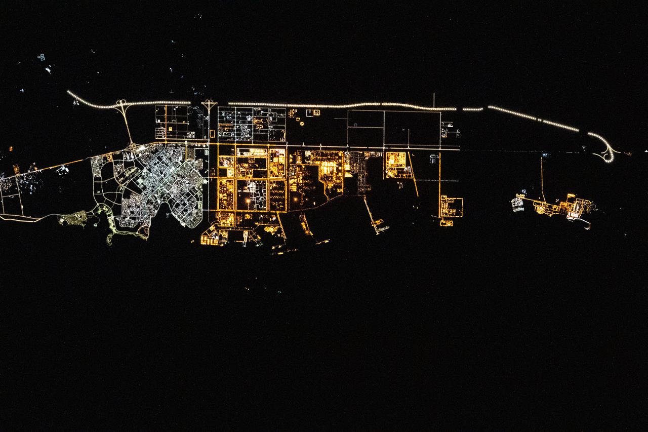 iss066e128404 (Jan. 26, 2022) --- The city lights of Yanbu, a Saudi Arabian port city on the Red Sea coast, are pictured during an orbital nightime pass from the International Space Station as it orbited 260 miles above.