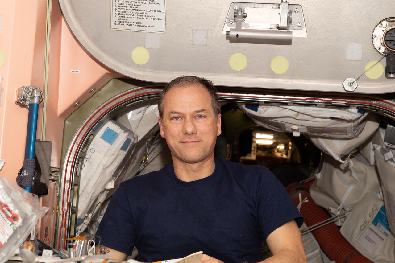 iss066e133931 (Feb. 2, 2022) --- NASA astronaut and Expedition 66 Flight Engineer Thomas Marshburn poses for a portrait inside the Unity module during his lunch period aboard the International Space Station.