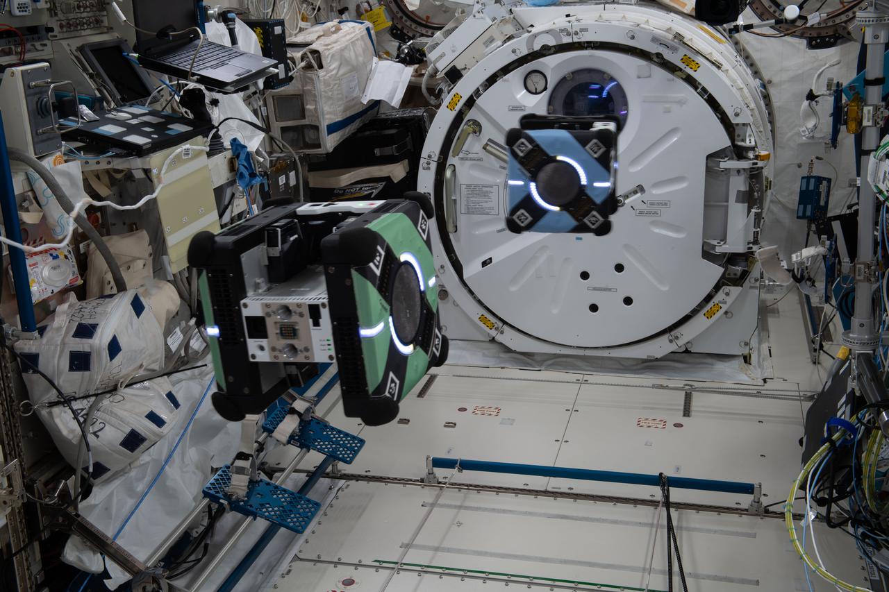 iss066e134584 (Feb. 2, 2022) --- A pair of free-flying Astrobee robotic assistants test automated rendezvous maneuvers using an algorithm for the ROAM, or Relative Operations for Autonomous Maneuvers, technology demonstration inside the International Space Station's Kibo laboratory module.