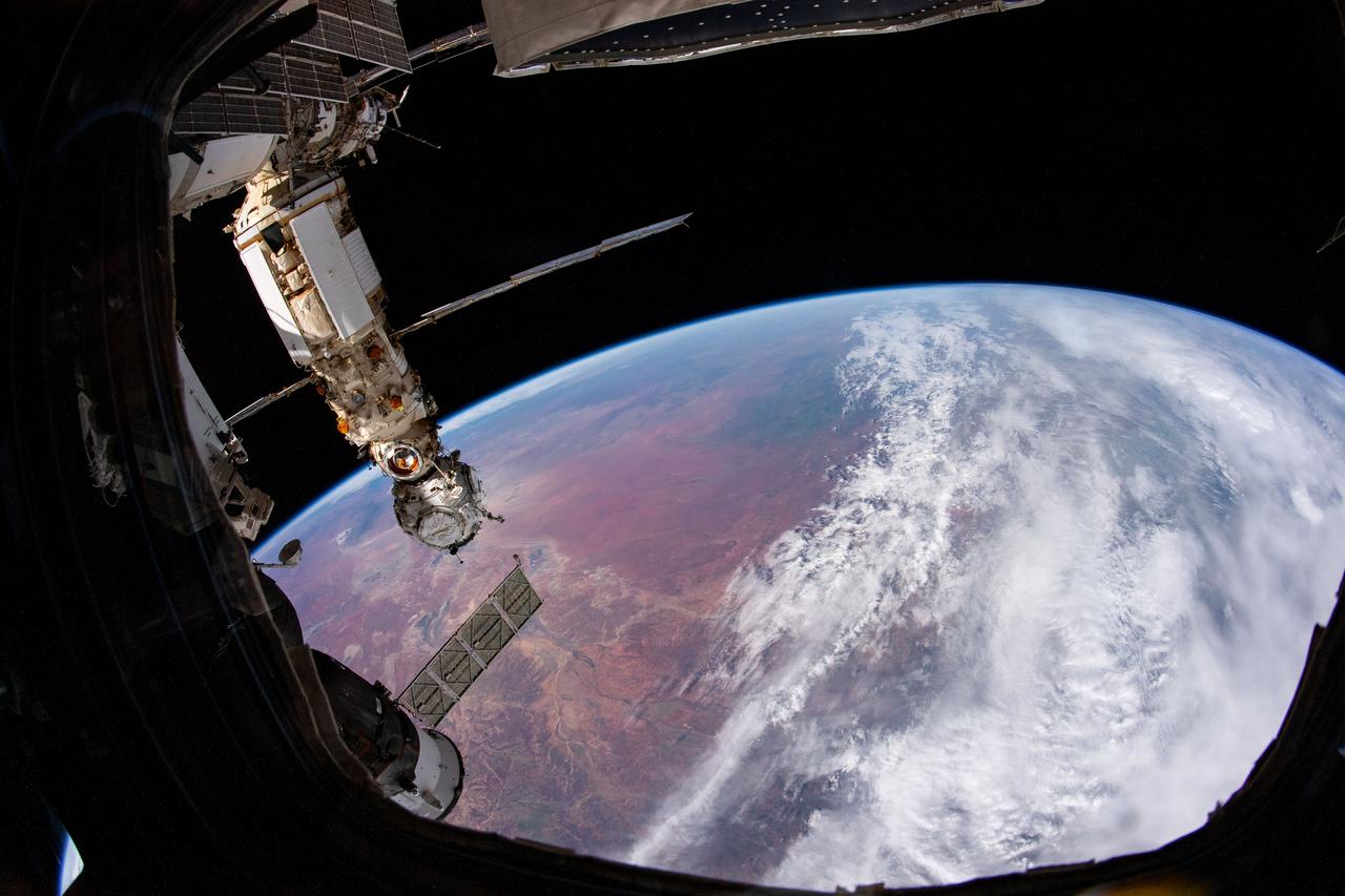 iss066e135344 (Feb. 3, 2022) --- The Nauka multipurpose laboratory module and the Prichal docking module are pictured as the International Space Station orbited 265 miles above central Australia. At lower left, is a portion of the Soyuz MS-19 crew ship docked to the Rassvet module.