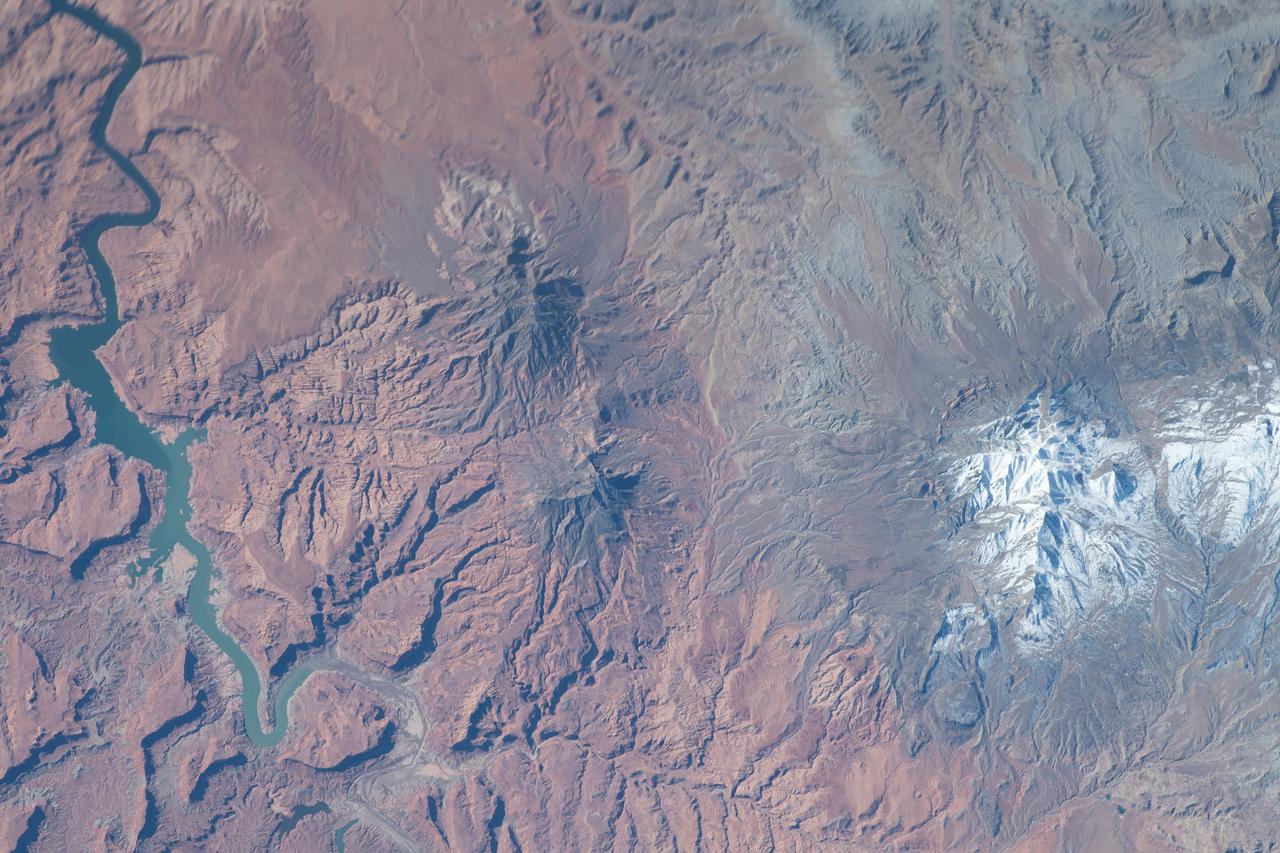 iss066e136836 (Feb. 5, 2022) --- Lake Powell with Mount Ellsworth and Mount Holmes at center, and the snow-capped Mount Hillers at right, are pictured from the International Space Station as it orbited 259 miles above the state of Utah.