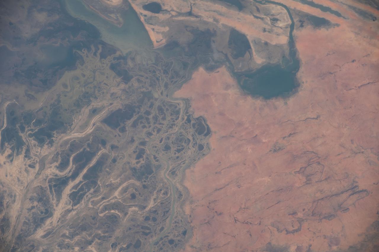 iss066e137361 (Feb. 7, 2022) --- The Niger River runs through Mali and leads to Lake Deebo in this picture from the International Space Station as it orbited 259 miles above the African nation. The historical city of Timbuktu (out of frame) is farther to the north and lies near the river.