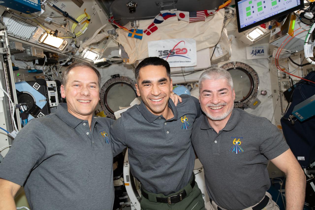 iss066e138134 (Feb. 9, 2022) --- From left, NASA's Expedition 66 Flight Engineers Thomas Marshburn, Raja Chari and Mark Vande Hei pose for a portrait inside the International Space Station's Kibo laboratory module.