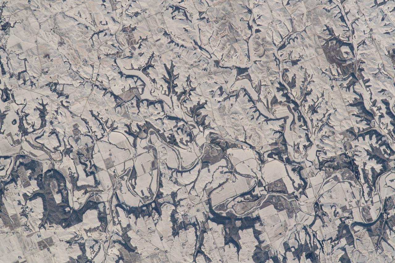 iss066e143485 (Feb. 13, 2022) --- The snow and ice-covered state of Minnesota on its southeast border with Wisconsin is pictured from the International Space Station as it orbited 260 miles above.