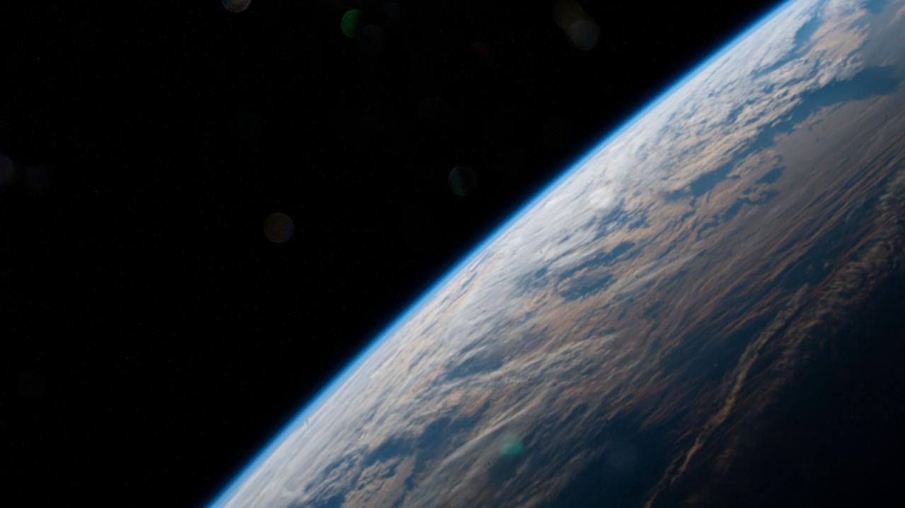 iss066e152101 (Feb. 22, 2022) --- The Earth is illuminated shortly after an orbital sunrise in this photograph from the International Space Station as it orbited 262 above the Pacific Ocean south of Alaska's Aleutian Islands.