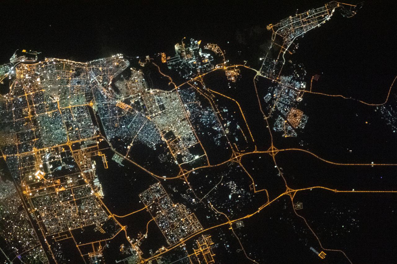 iss066e153994 (Feb. 26, 2022) --- The city lights of Sharjah and Ajman are pictured during an orbital night pass as the International Space Station orbited 261 miles above the northeastern tip of the United Arab Emirates near the Strait of Hormuz.