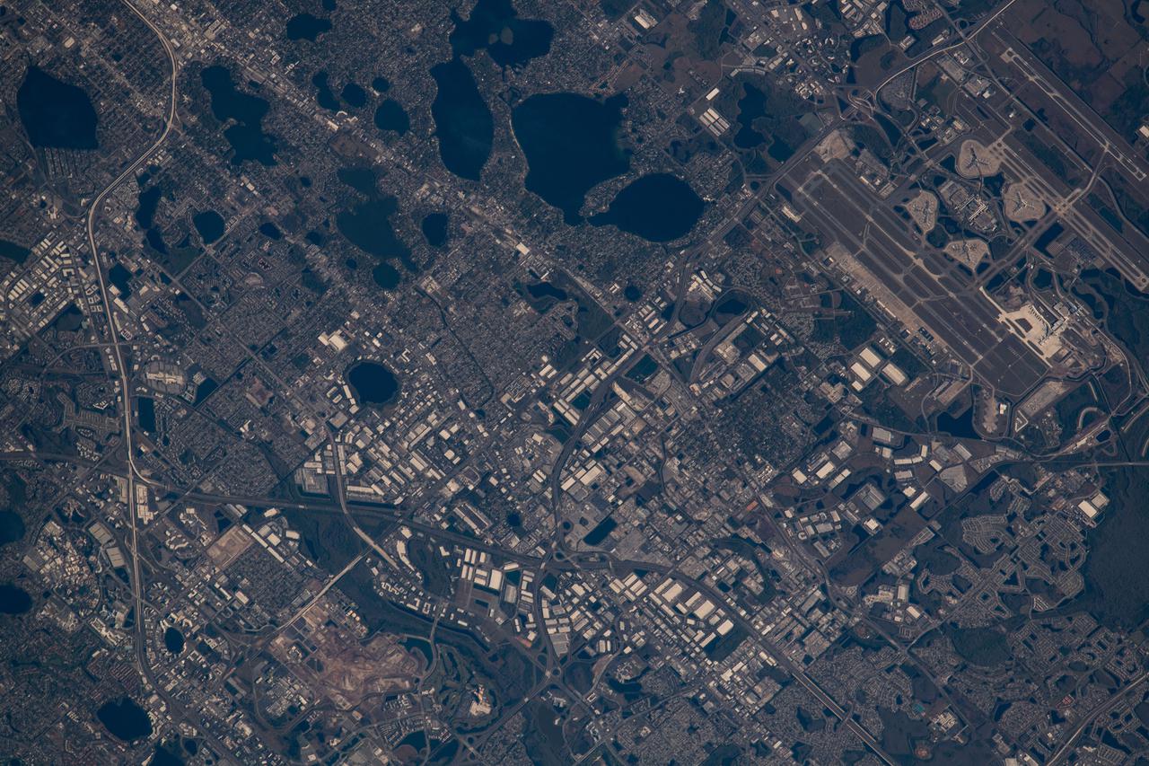 iss066e156707 (March 3, 2022) --- Orlando, Florida, with Orlando International Airport at right, is pictured from the International Space Station as it orbited 260 miles above the Atlantic Ocean off the coast of the Sunshine State.