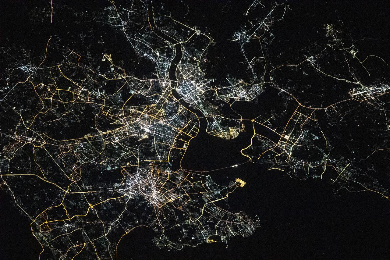 iss066e158512 (March 8, 2022) --- Quanzhou, a port city on China's Taiwan Strait, split by the Jinjiang River, is pictured during an orbital night pass from the International Space Station at an altitude of 262 miles above the Asian nation.